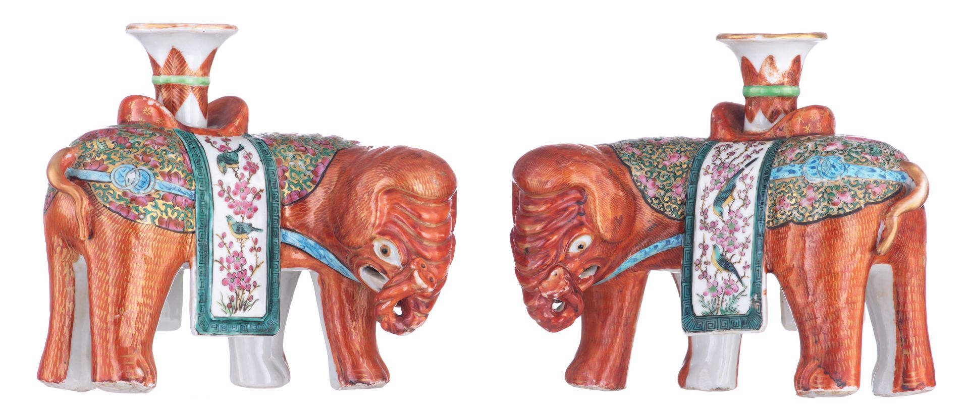 A pair of Chinese red-coral ground and famille rose elephant-shaped joss stick holders, first half o