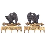 A fine pair of Empire style patinated bronze andirons, each with an eagle holding a salamander and a