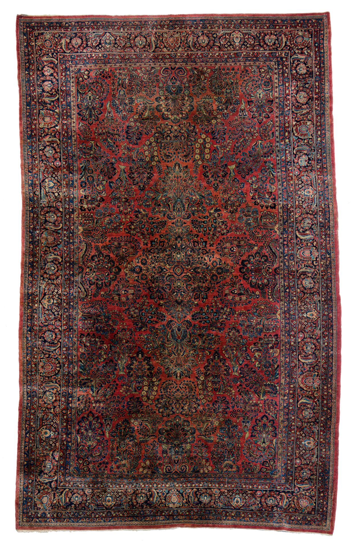 A large Oriental woollen rug, floral decorated, 306 x 511 cm