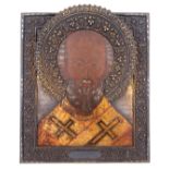 A Russian icon depicting Saint Nicholas of Myra, with a silver oklad, 875/000, with a Russian hallma