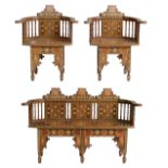 A fine Moorish inspired furniture set, consisting of two armchairs and a settee, inlaid with various