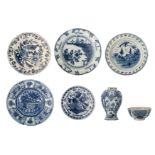 A collection of seven 18thC blue and white decorated Dutch Delftware items, consisting of five plate