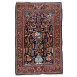 An Oriental woollen rug, decorated with a hare in a landscape and a fountain, 133 x 209 cm