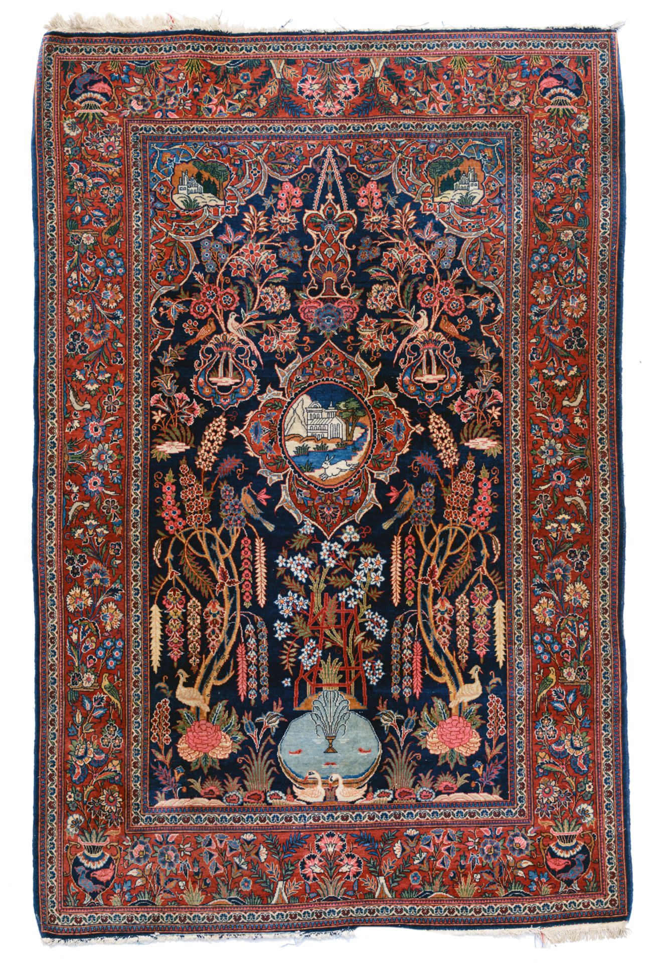 An Oriental woollen rug, decorated with a hare in a landscape and a fountain, 133 x 209 cm