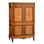 A large Louis XVI style two doors cupboard, decorated with marquetry in various wood species, and de