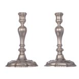 A pair of régence style Ghent (17)57 hallmarked silver candlesticks, makers' mark illegible, re-hall