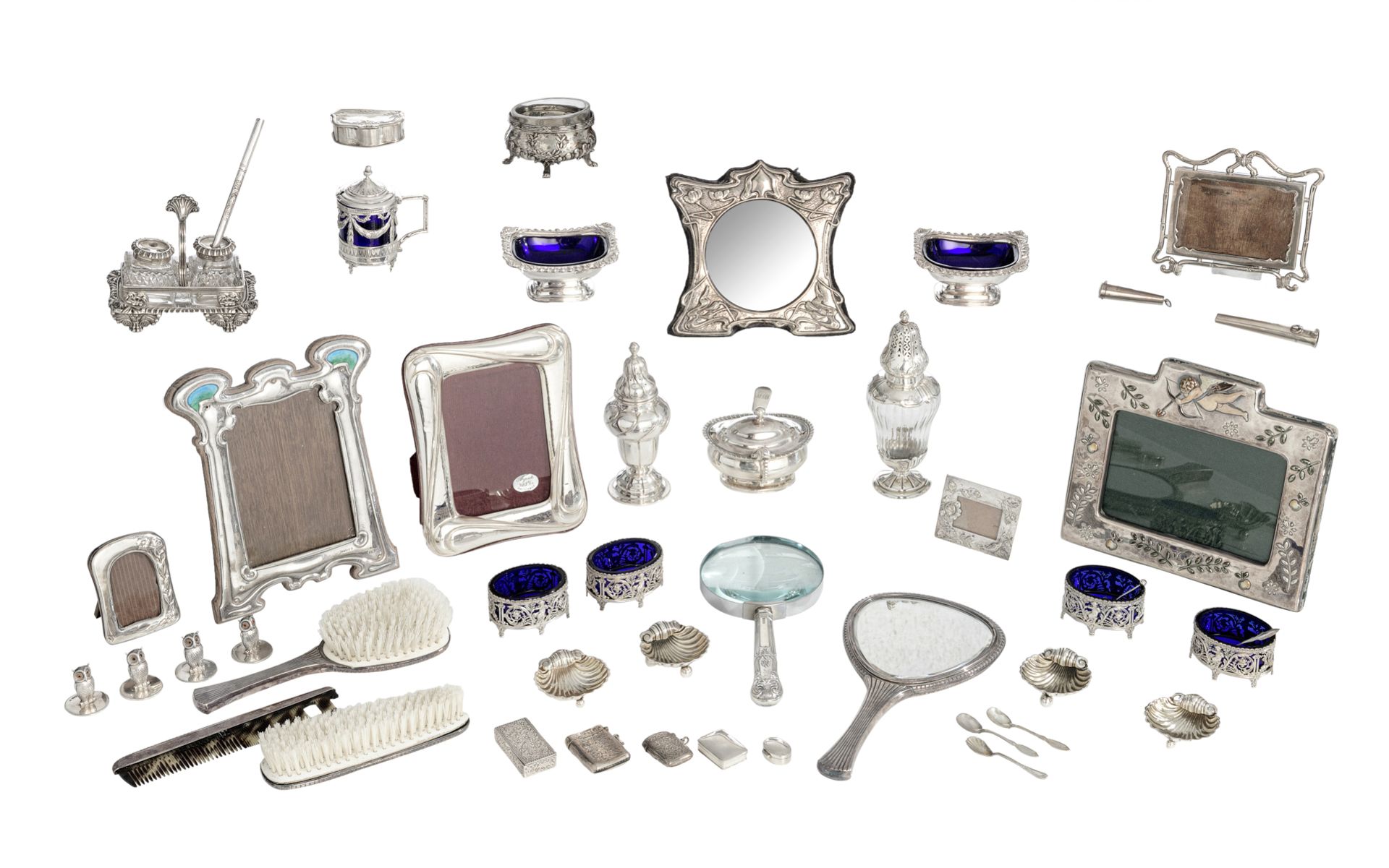 A varied lot of 19th and 20thC, mostly English silver gadgets, photo frames, and tablewares