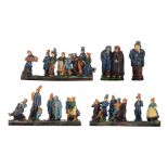 A collection of typical Flemish earthenware figure groups in the Arts & Crafts manner, consisting of