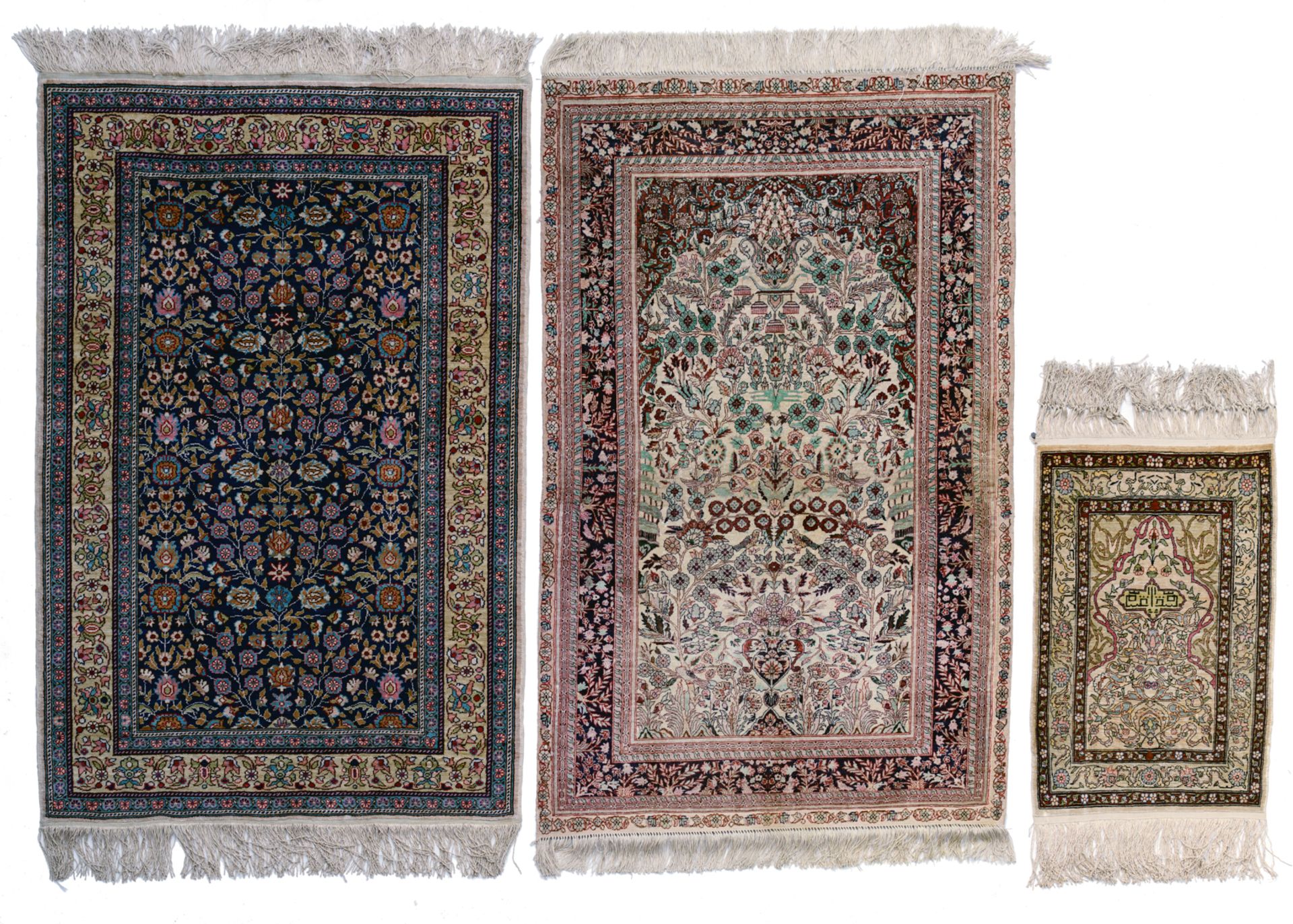 An Oriental silk carpet, floral decorated, 120 x 79 cm; added: an Oriental silk and wool carpet, dec