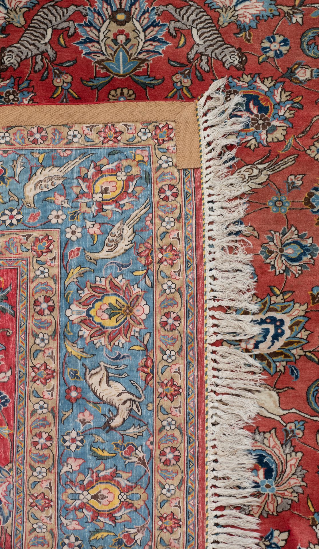 An Oriental woollen rug, decorated with hunting lions, deer and birds surrounded by flowers, 234 x 3 - Image 3 of 5