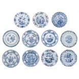 Eleven Chinese blue and white floral decorated dishes, 18thC, ø 20,5 - 24 cm