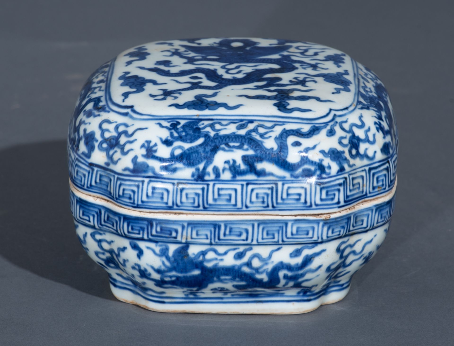 A Chinese Ming style blue and white rectangular box and cover, the top panel decorated with a dragon - Image 2 of 10