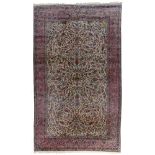 A large Oriental woollen rug, floral decorated, 375 x 623 cm