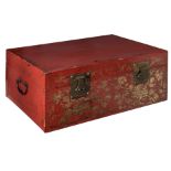 An Oriental red lacquered storage trunk, the front gilt decorated with birds and flower branches, th