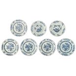 Five Chinese blue and white floral decorated dishes, the centre with butterflies; added two ditto di