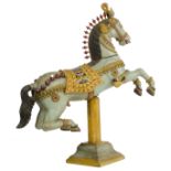 A large wooden polychrome painted prancing carousel horse, H 162 - W 140 - D 37 cm