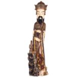 A very imposing Chinese Beijing ivory statue, richly carved and polychrome painted and depicting a l