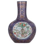 A Chinese blue ground and floral gilt decorated bottle vase, the roundels famille verte enameled wit