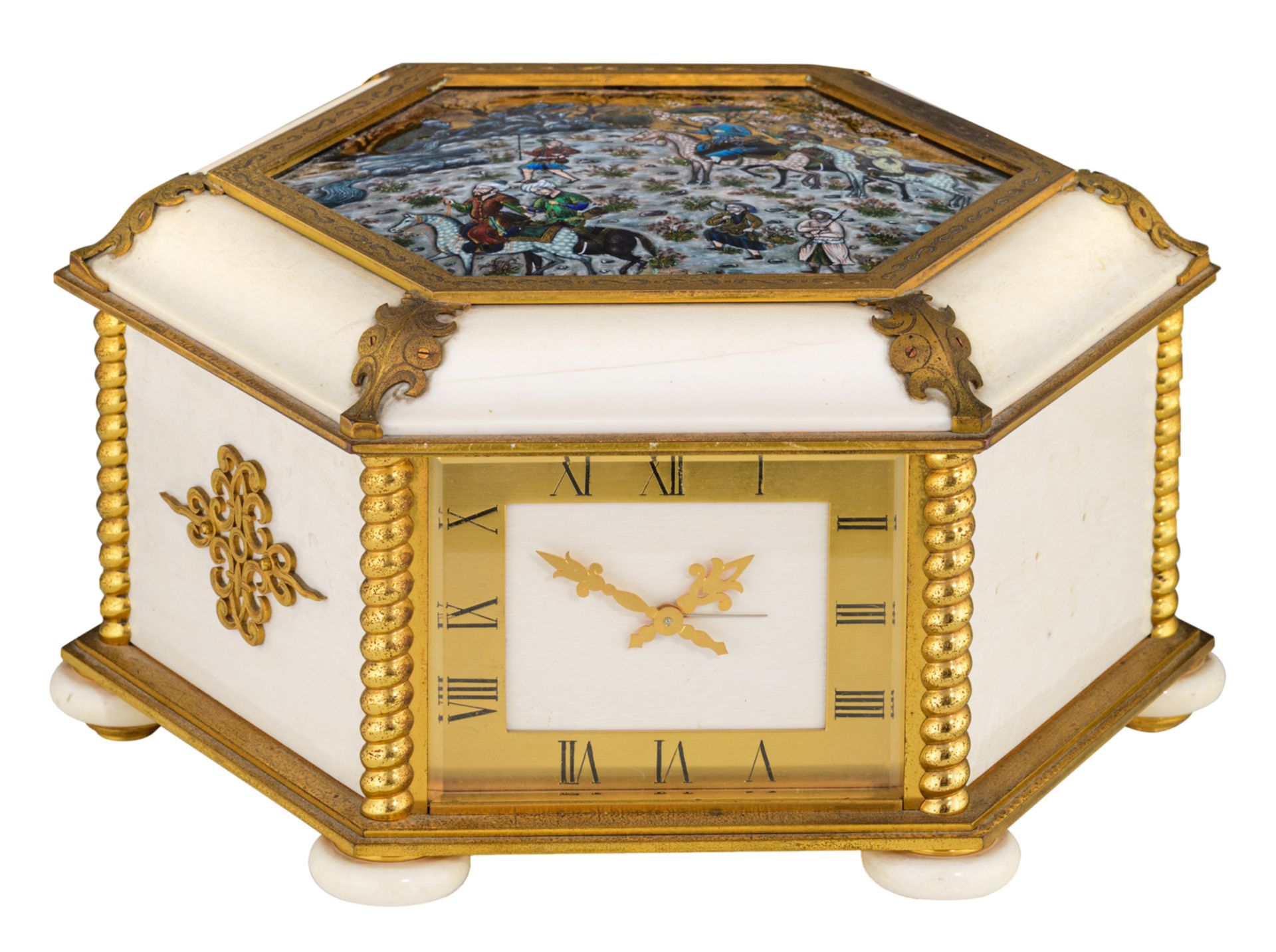 A combined hexagonal box containing a jewelry store-compartment, a table clock and a barometer, gilt