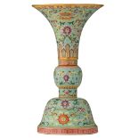 A Chinese turquoise ground famille rose altar gu vase, decorated with the Eight Buddhist Emblems 'Ba