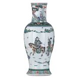 A Chinese famille verte baluster-shaped vase, overall decorated with an animated scene with figures