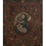 A richly embroidered reliquary devotional work, containing the relics of various saints, silver and