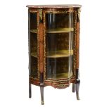 A  rosewood veneered Napoleon III display cabinet with a wavy front, decorated with gilt bronze moun