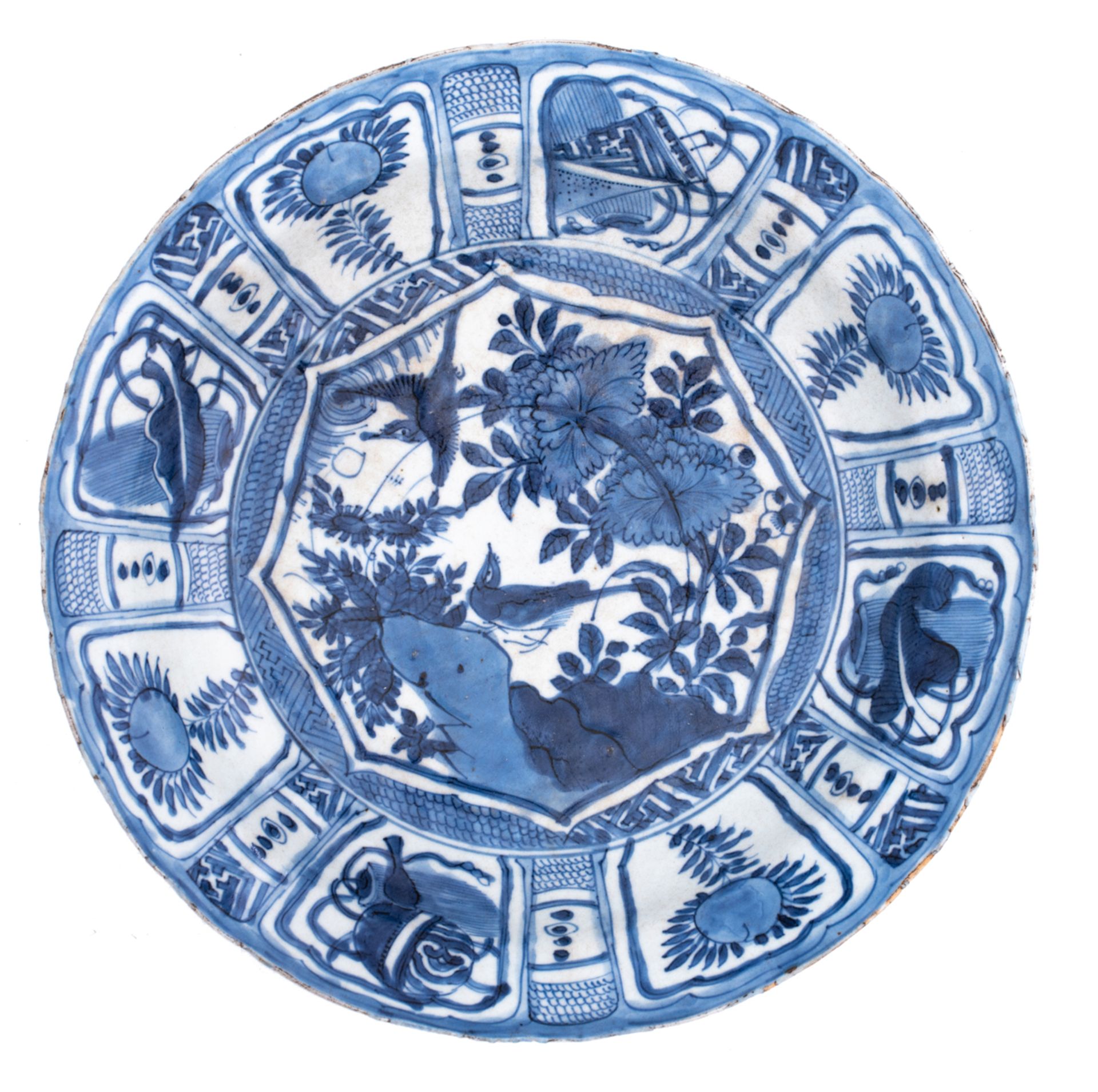 A Chinese Wanli blue and white Kraak porcelain plate, decorated with a pair of birds amidst flower b