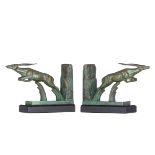Le Verrier M., a fine pair of Art Déco bookends, shaped as jumping antilopes, patinated bronze on a