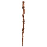 A probably box wooden Spanish-Filipino colonial walking stick, richly carved and decorated with an u