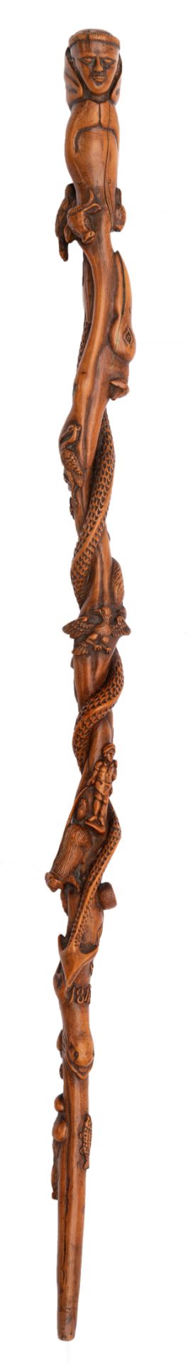 A probably box wooden Spanish-Filipino colonial walking stick, richly carved and decorated with an u