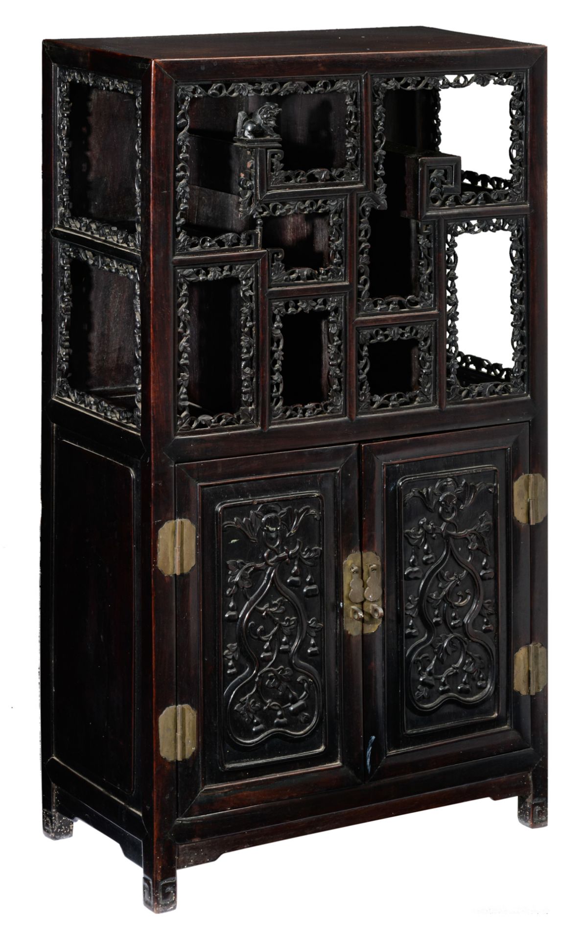 A Chinese exotic hardwood display cabinet, with richly carved open work bands and brass mounts, deco