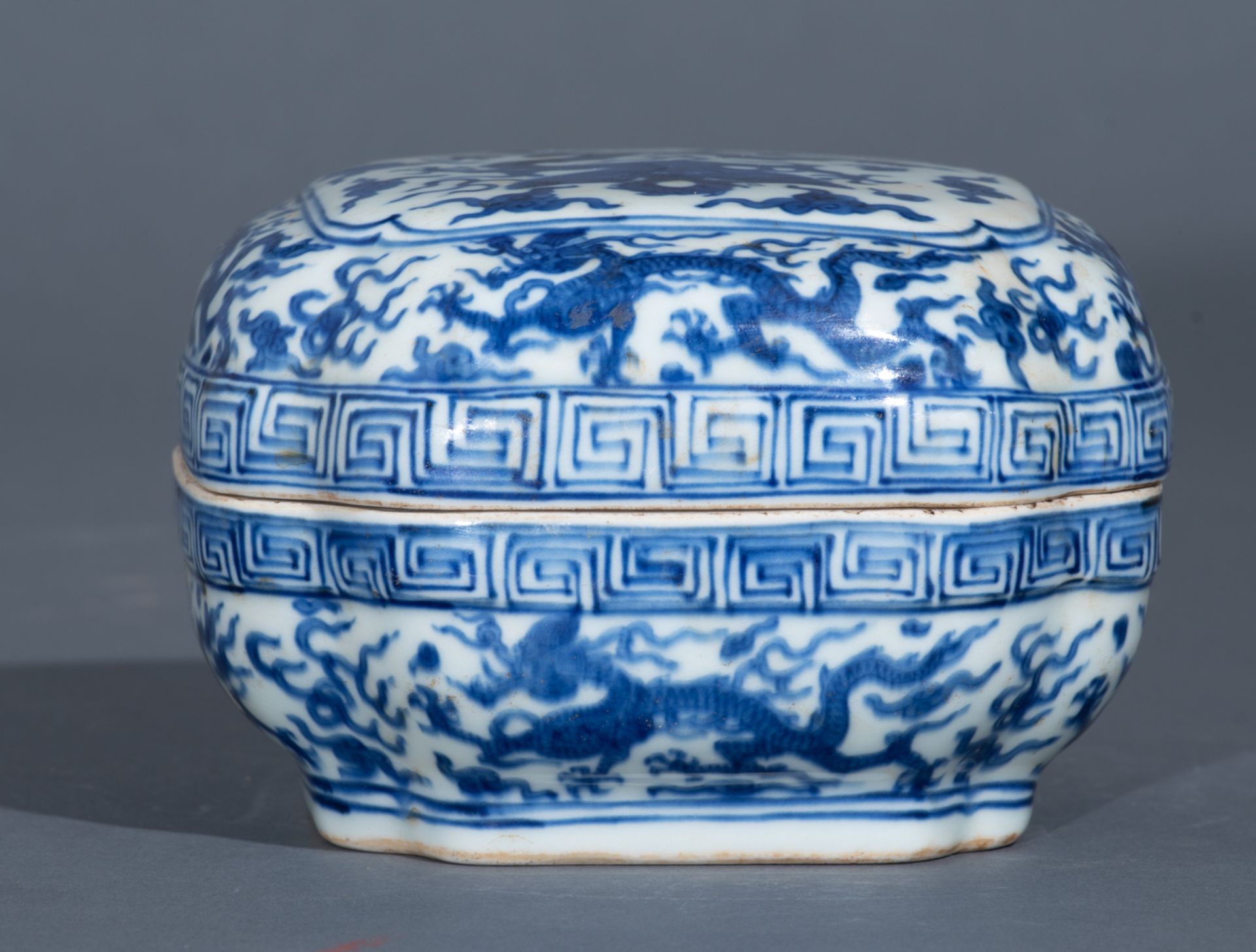 A Chinese Ming style blue and white rectangular box and cover, the top panel decorated with a dragon - Image 5 of 10