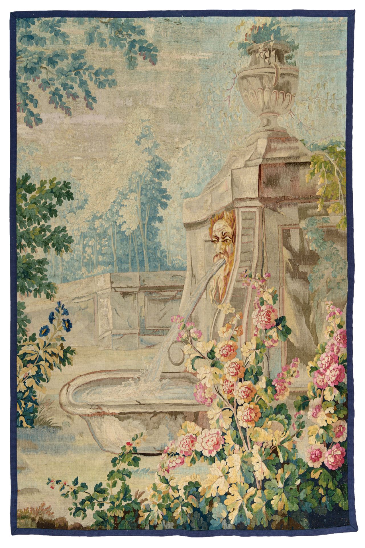 A fragment of a Beauvais wall tapestry, depicting a squirting fountain in an Italianate flower garde