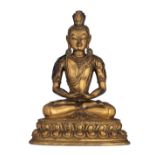 A Sino-Tibetan gilt bronze seated Buddha with precious stone inlay, on a double lotus base, H 16,5 c