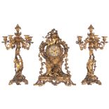A gilt bronze Rococo Revival three-piece clock garniture, the inside of the clock marked 'Richand F.