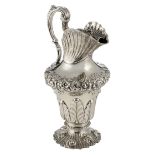 A lavishly worked Rococo Revival Irish silver ewer, Dublin hallmarked, makers' mark R.S., year lette