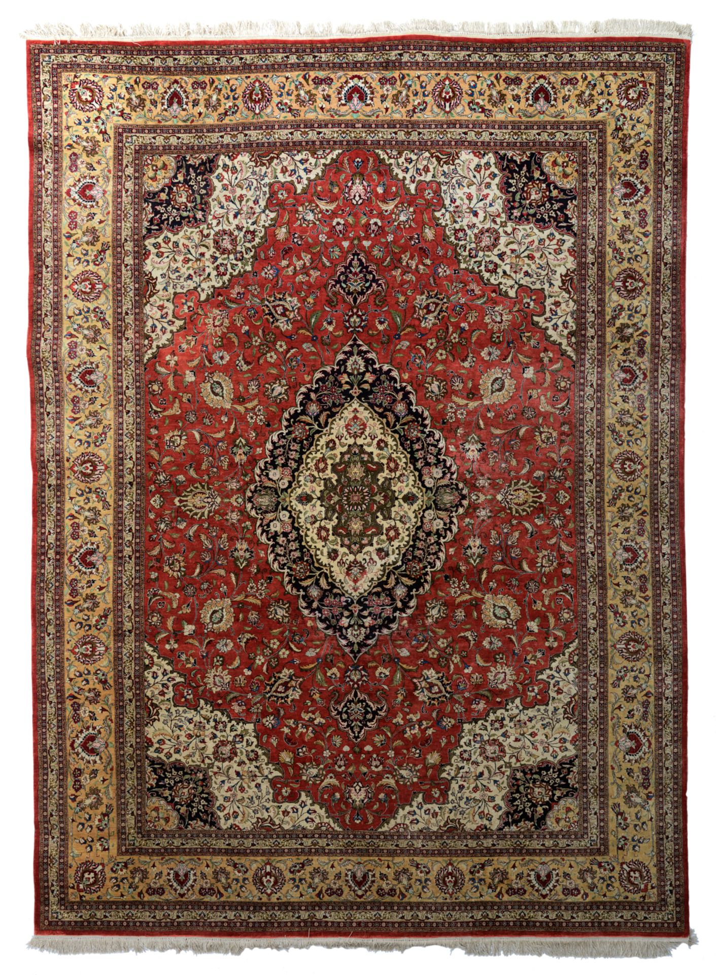 An Oriental woollen rug, floral decorated, 253 x 345 cm