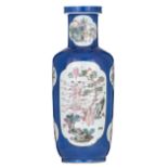 A Chinese bleu poudré rouleau-shaped vase, the panels famille rose decorated with figures in a lands