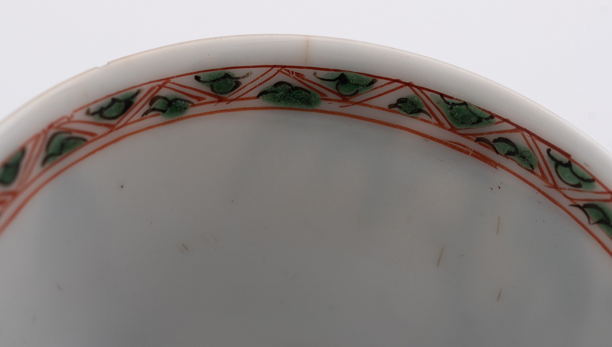 A Chinese famille verte cup and saucer, decorated with an erotic scene, Kangxi symbol mark and of th - Image 7 of 7