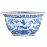 A Chinese blue and white jardinière, decorated with a pair of dragons chasing a flaming pearl amidst