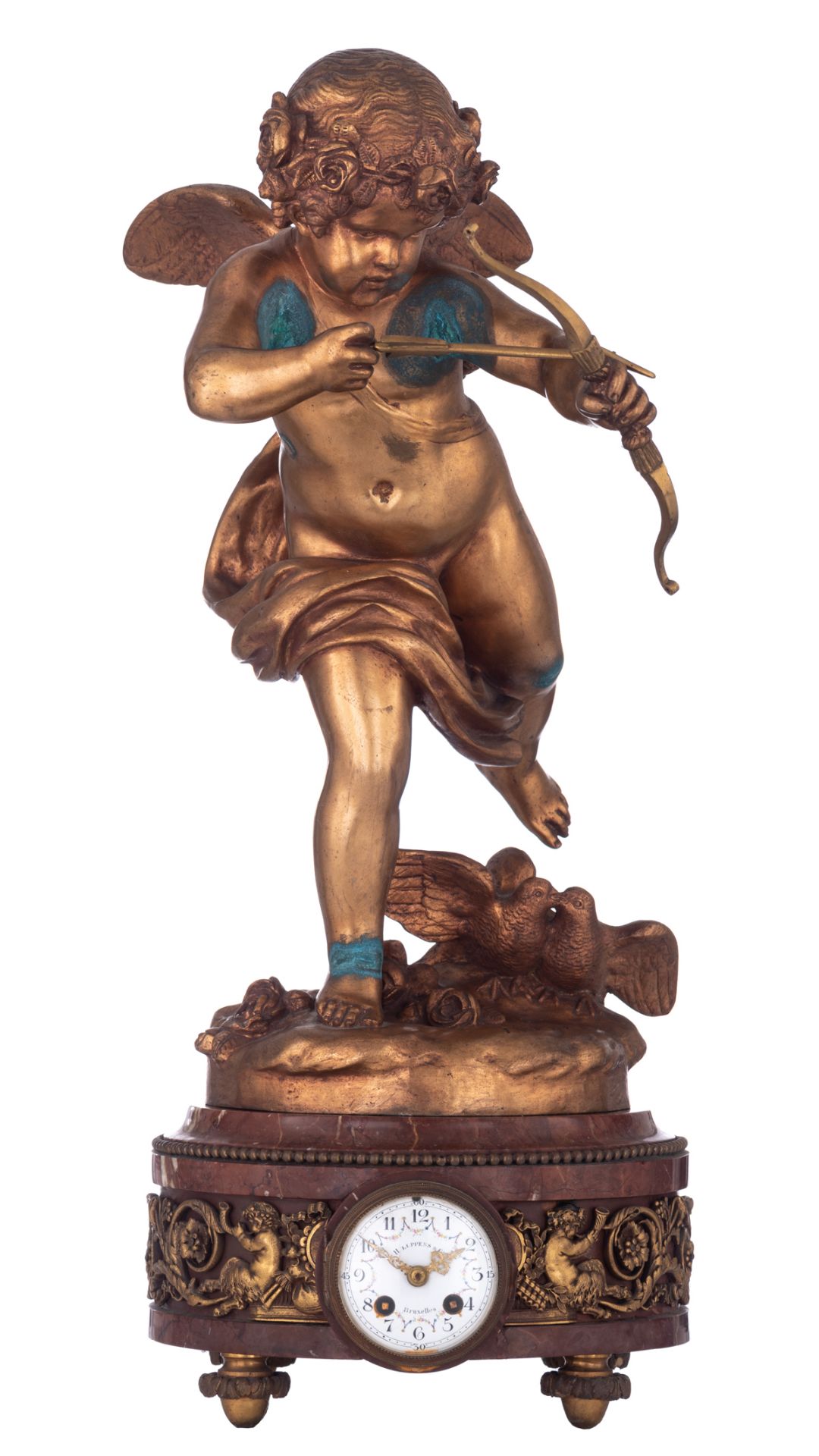 A rouge royal mantle clock, with on top a gilt bronze cupid firing an arrow, signed Houdon, the base