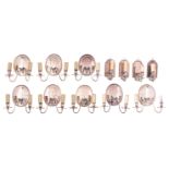 A series of eight silver-plated Neoclassical bracket lights, H 22 cm; added: a ditto series of four