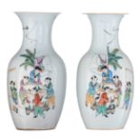 A pair of Chinese polychrome decorated vases, with boys in a garden playing with a fishbowl, H 42 cm