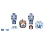 Two Chinese blue and white vases, with a Kangxi mark, and two ditto café au lait jars and covers; ad