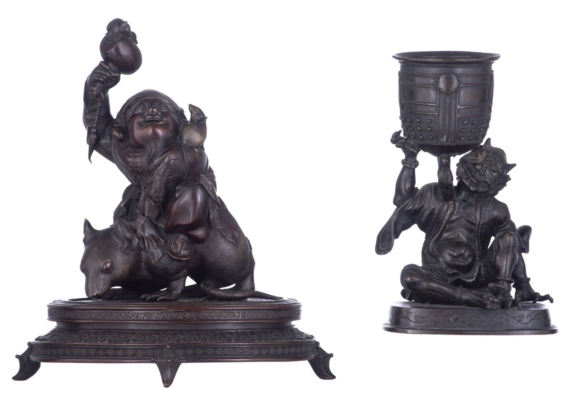 A Japanese bronze statue of the Buddhist god Daikoku, seated on a rat, on a base; added a ditto stat