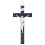 A finely sculpted ivory Corpus Christi on an ebony crucifix with an ivory hanging ring on top, 19thC