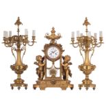 An imposing Neoclassical ormolu bronze three-piece mantle clock garniture, the clock decorated with