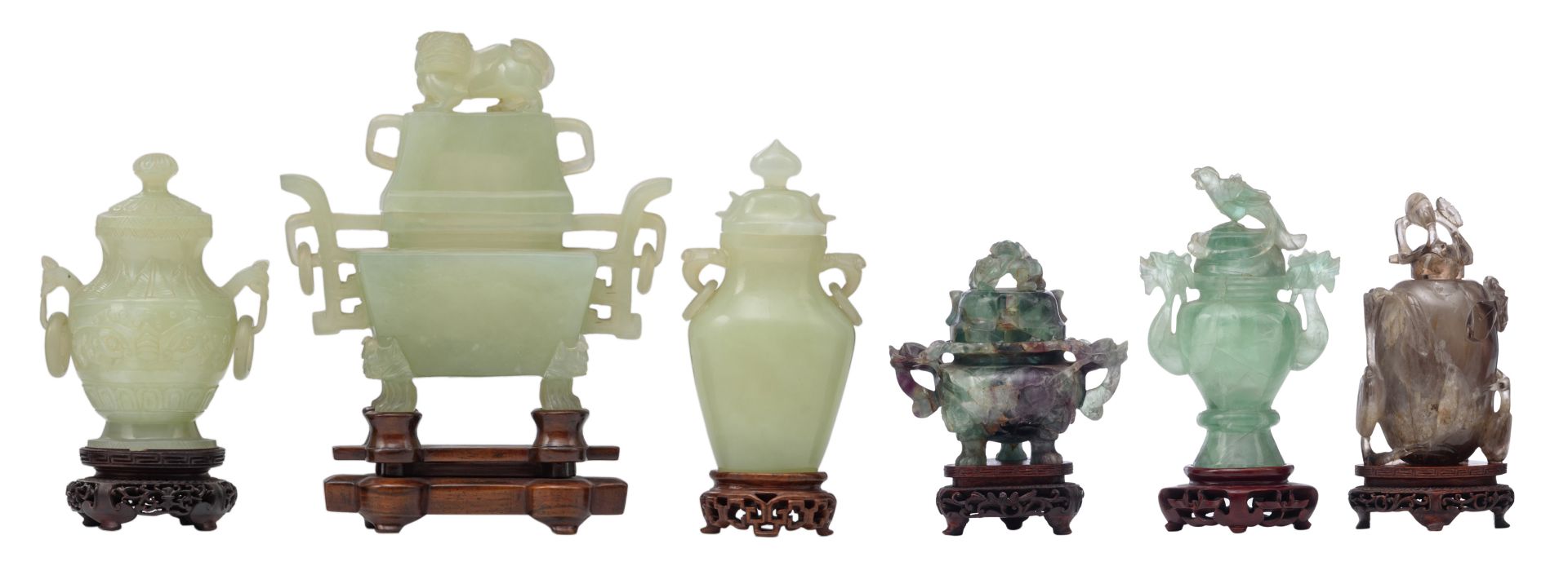 Three Chinese carved green jade vases and covers, Qing dynasty; added a Chinese carved smoky quartz