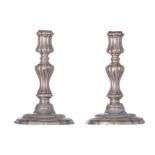 A pair of probably French 18thC Regency style candlesticks, indefinable hallmarks, H 15,4 - 15,8 cm